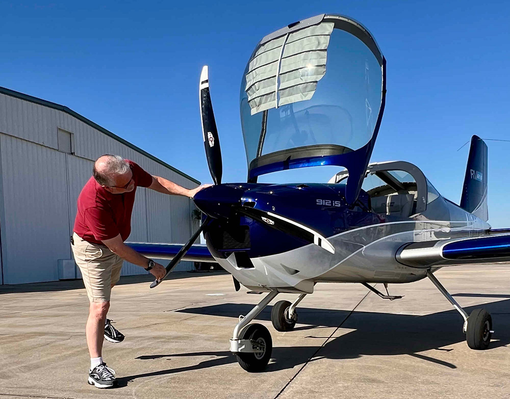 man with private plane